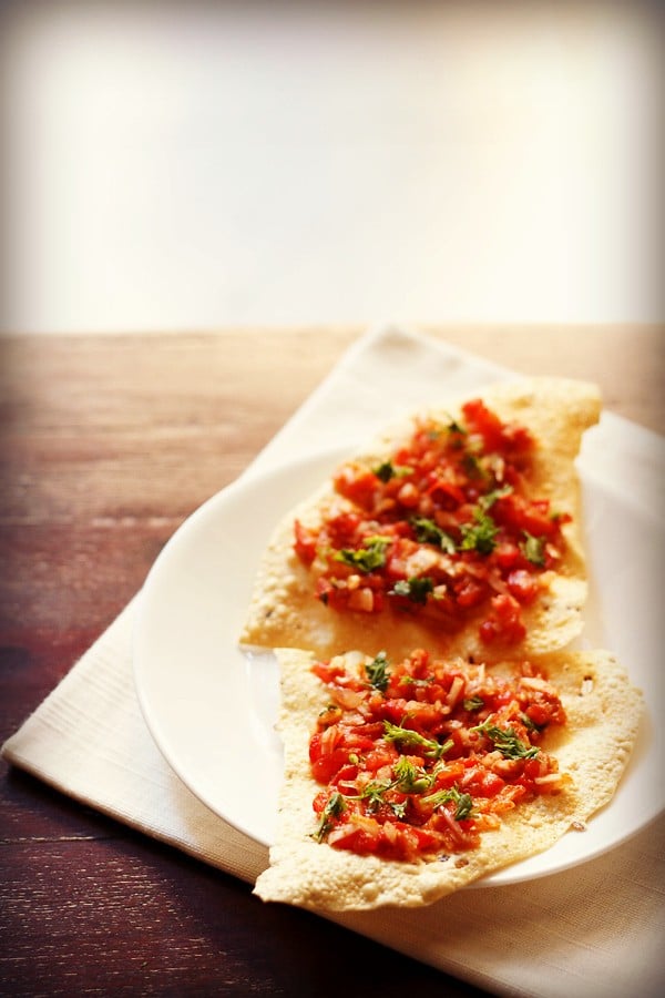 masala papad pieces served on a white plate. 