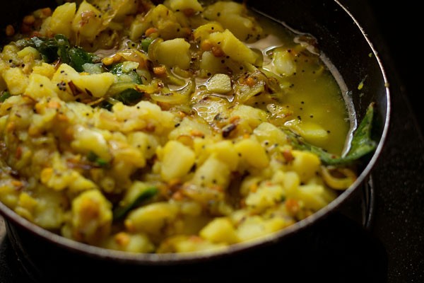 water added to the aloo bhaji. 