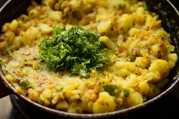 chopped coriander leaves added to the aloo bhaji. 