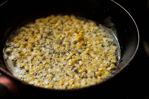 drained bengal gram added to the spices in the oil. 