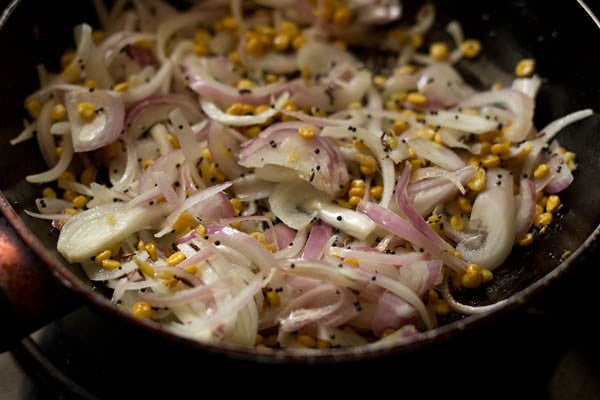 sautéing onions with the bengal gram-spice mixture for potato bhaji for dosa. 