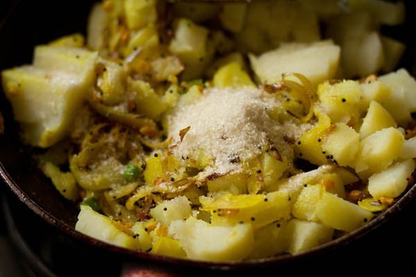 boiled cubed potatoes, salt and sugar added to the pan. 