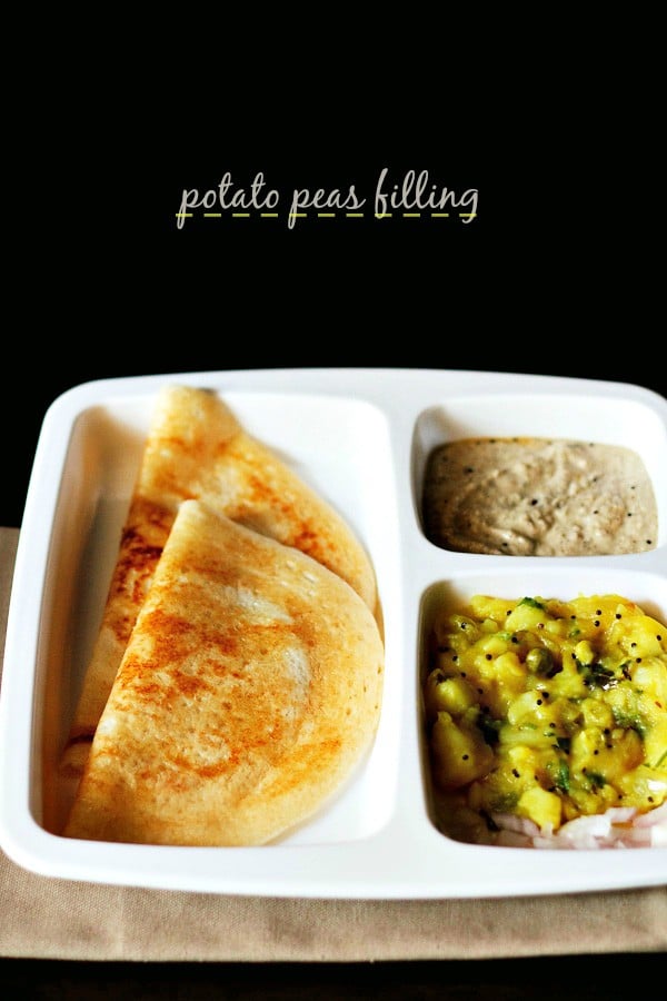 aloo masala for dosa served in a platter with 2 dosas, coconut chutney and text layover. 