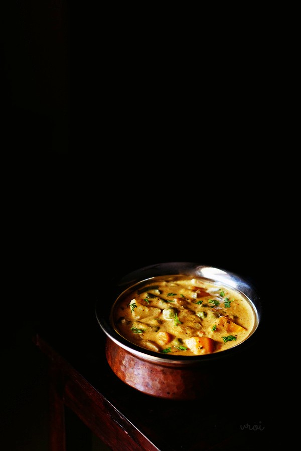 veg handi garnished with coriander leaves and served in a copper handi. 