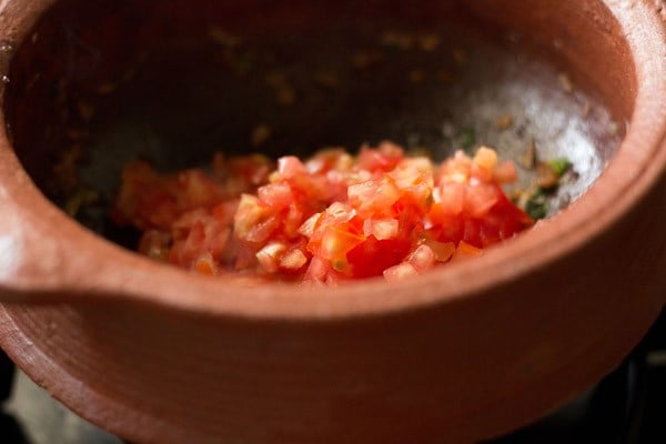 finely chopped tomatoes added to handi. 