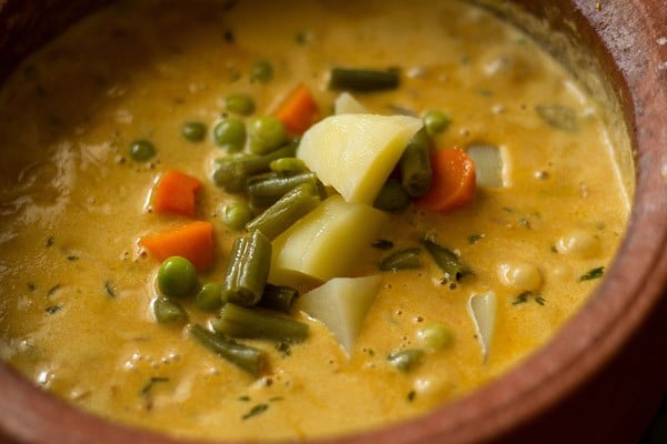 add steamed veggies - making veg handi recipe