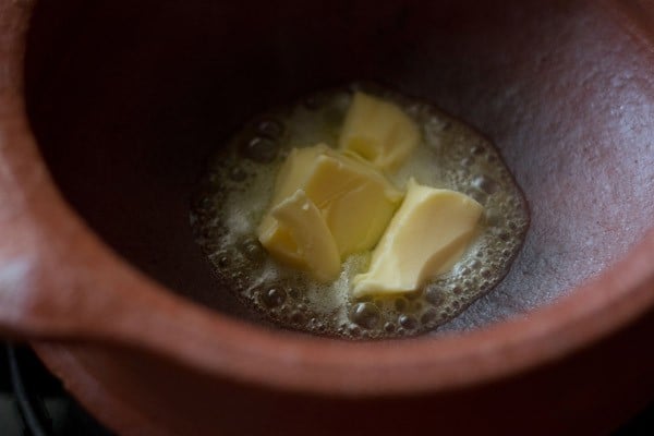 melting butter to prepare veg handi recipe