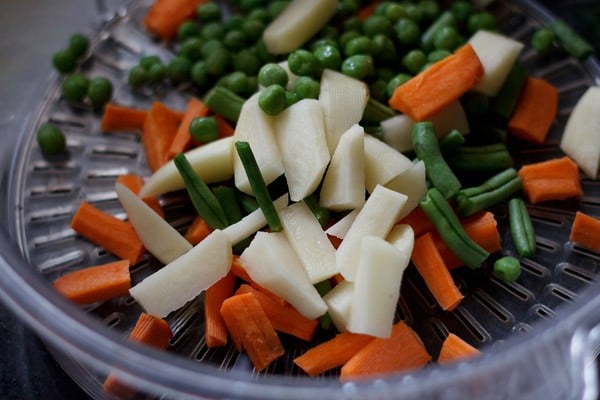 rinsing, peeling and cutting vegetables for veg kolhapuri 