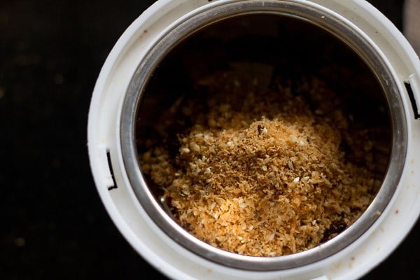 cooled roasted spice mixture in grinder jar