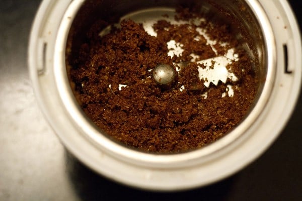 grinding spice mixture to make kolhapuri masala 