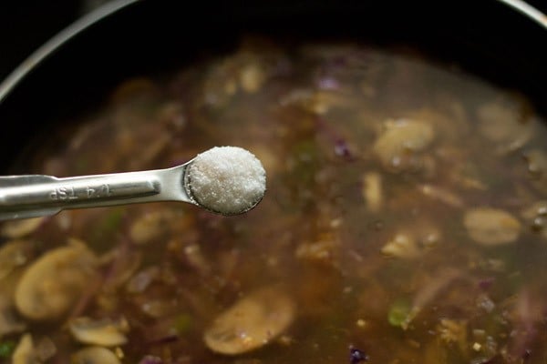 adding salt to the broth