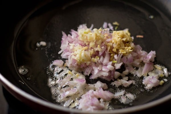 heating onion and garlic in a wok