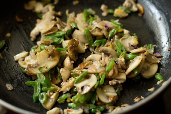 stir frying the mushrooms