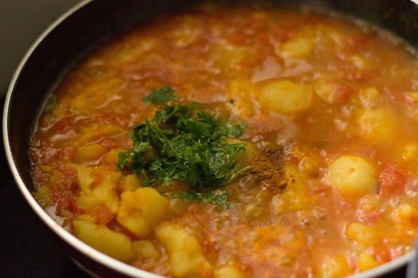 chopped coriander leaves and garam masala powder added to the potato gravy.