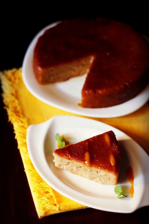 slice of caramel bread pudding on white plate.