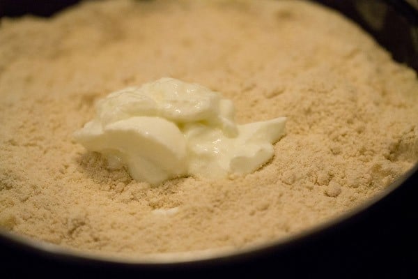 adding yogurt to the flour and butter