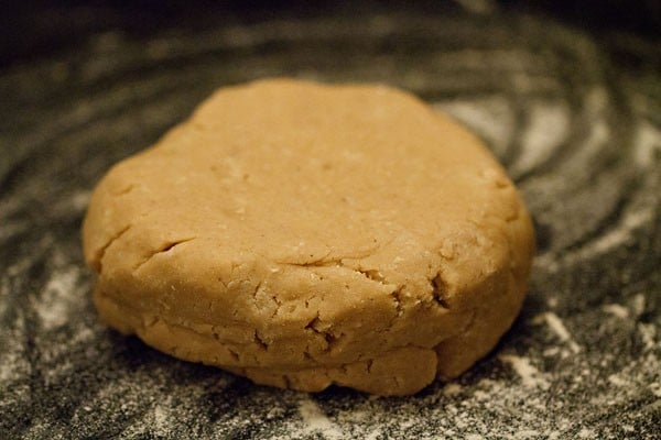 dough in a mound on a floured surface