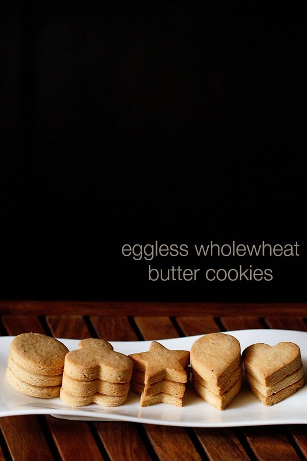 butter cookies stacked neatly on a white tray.