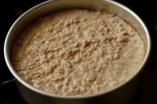 mashed bread pudding mixture in round pan.