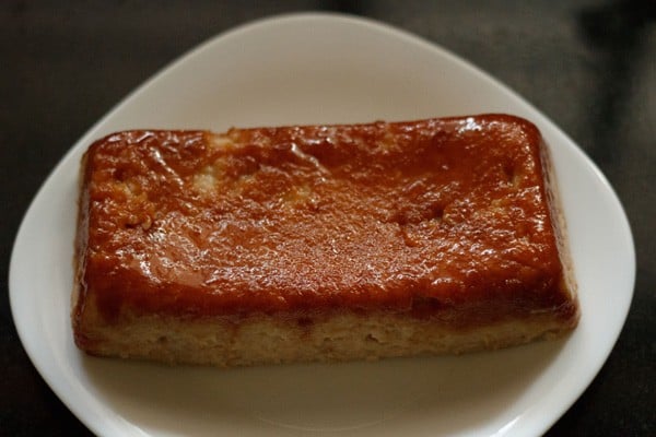 caramel bread pudding on a plate.