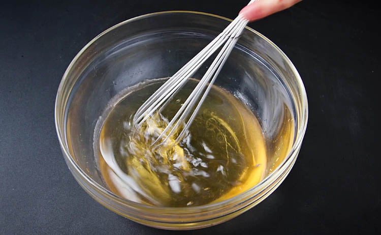 mixing oil with a whisk