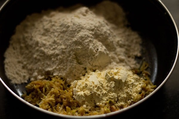 flours added to spiced grated bottle gourd mixture for dudhi na thepla. 