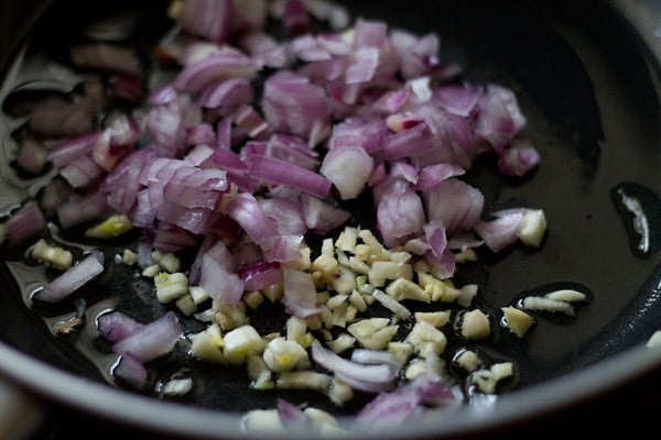 sauteing onion garlic in a pan