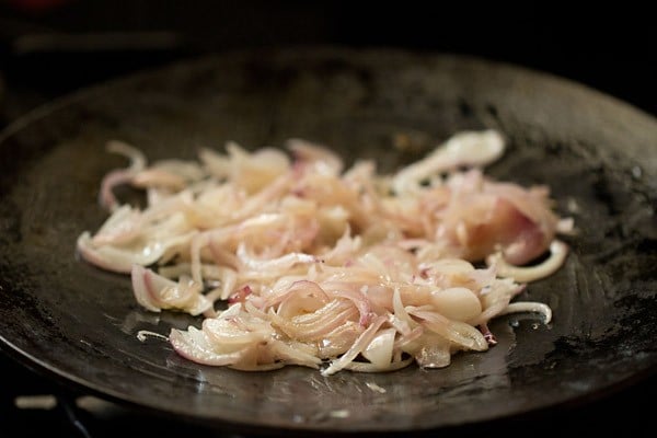 sauteing sliced onions on tawa tilll translucent