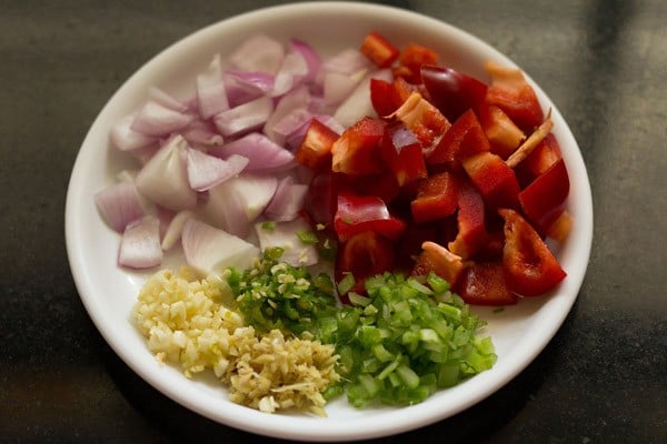 dry paneer manchurian ingredients in a white plate