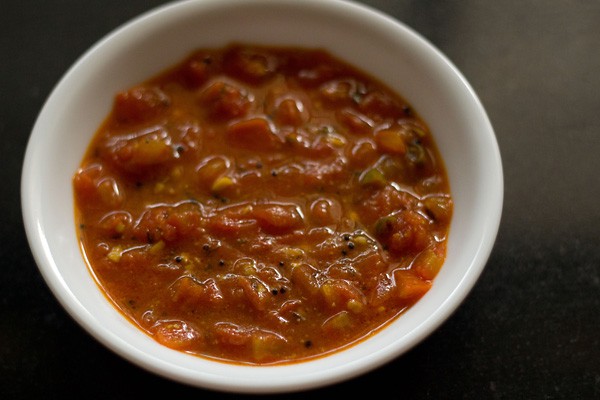 cooked tomato curry in a bowl. 