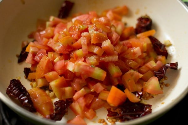 chopped tomatoes and asafoetida added to the spices. 