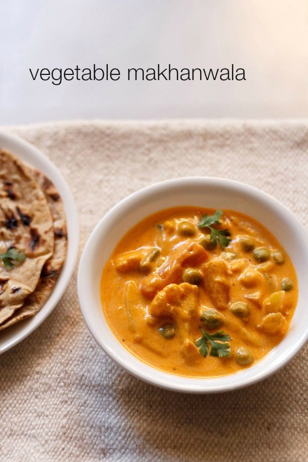 veg makhanwala garnished with coriander leaves and served in a white bowl with text layover.