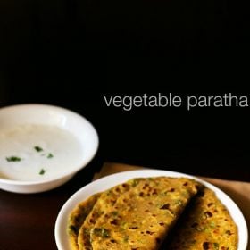 mix veg paratha served on a white plate with a bowl of curd kept on the top left side and text layover.