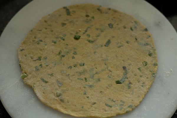 rolled mix veg paratha on a board