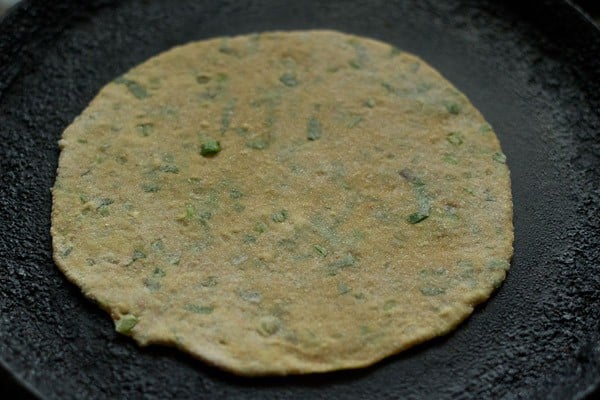 cooking mix veg paratha on tawa