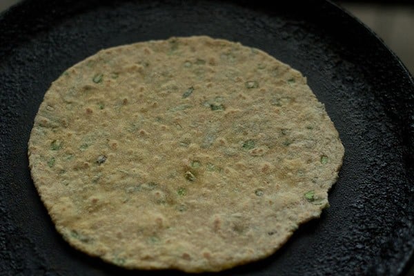 cooking mix veg paratha on tawa