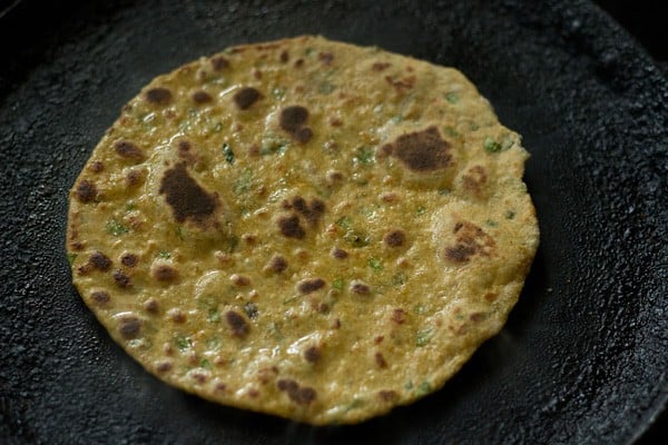 cooked vegetable paratha on tawa