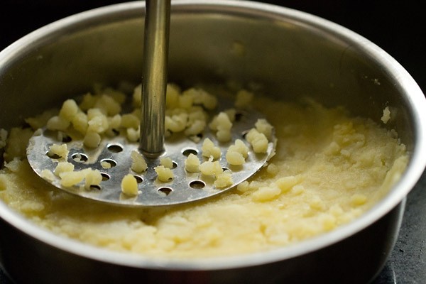 peeling and mashing potatoes for stuffing 