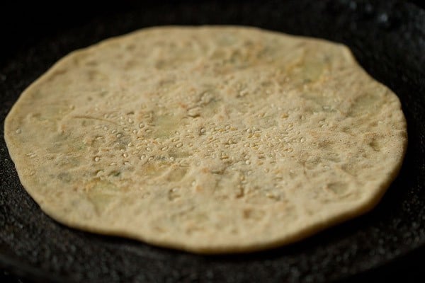 rolled kulcha on tawa flipped and fried