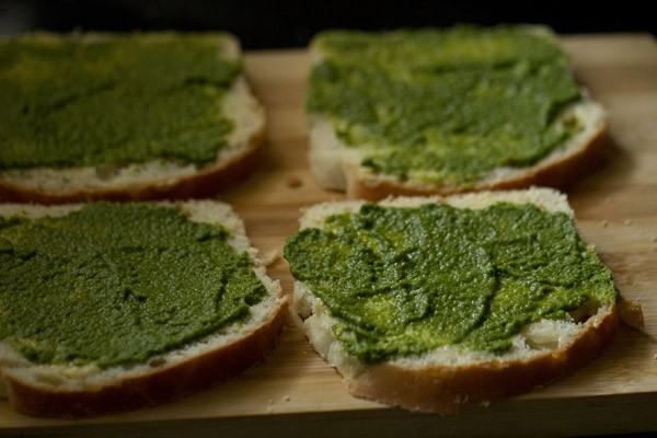 prepared chutney spread on buttered bread slices. 