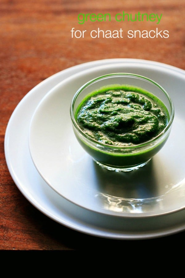 green chutney in glass bowl on two white plates.