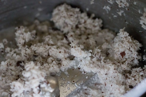 grated coconut in grinder jar