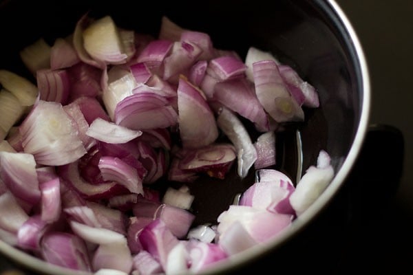 ¾ cup roughly chopped onions and water in a pan