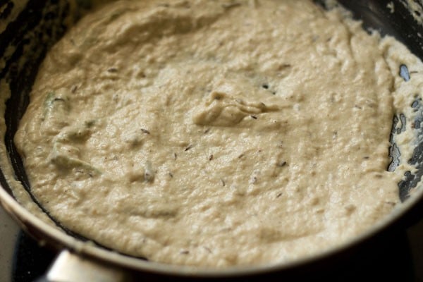 adding rest of curd and mixing with gravy