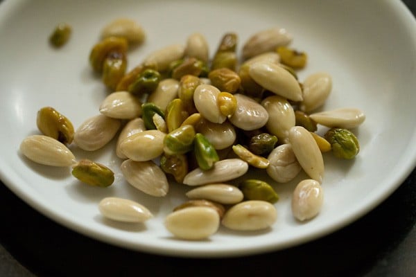 blanched almonds and pistachios in a white plate