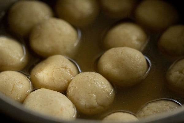 rasgulla in pan with sugar syrup