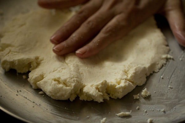 hand kneading chenna dough for rasgulla now coming together