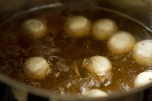 rasgulla simmering in sugar syrup