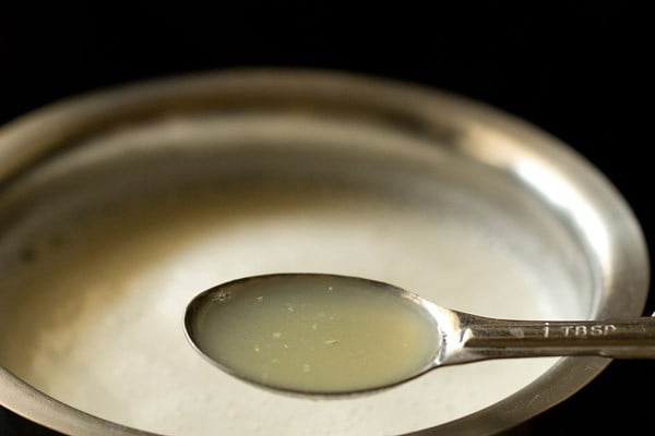 curdling milk with a tablespoon of the whey to show that it is done