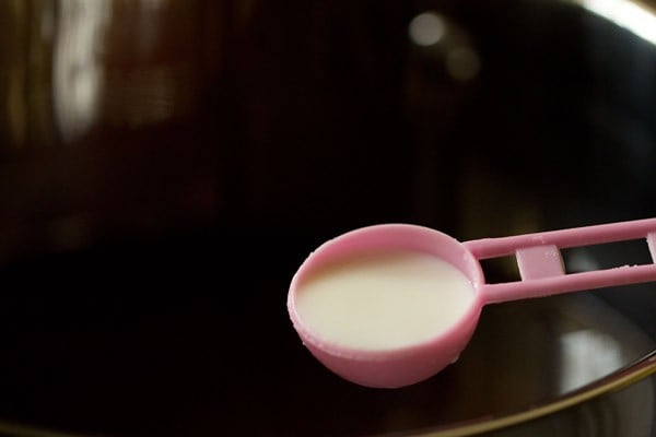 tablespoon of milk above the sugar syrup for clarifying it